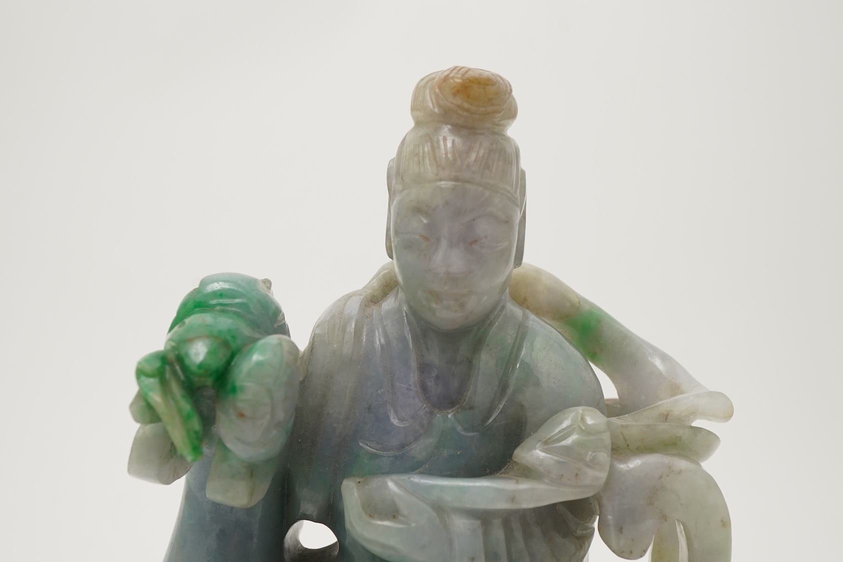 A Chinese jadeite figure of Xi Wangmu riding on a phoenix, late 19th/early 20th century